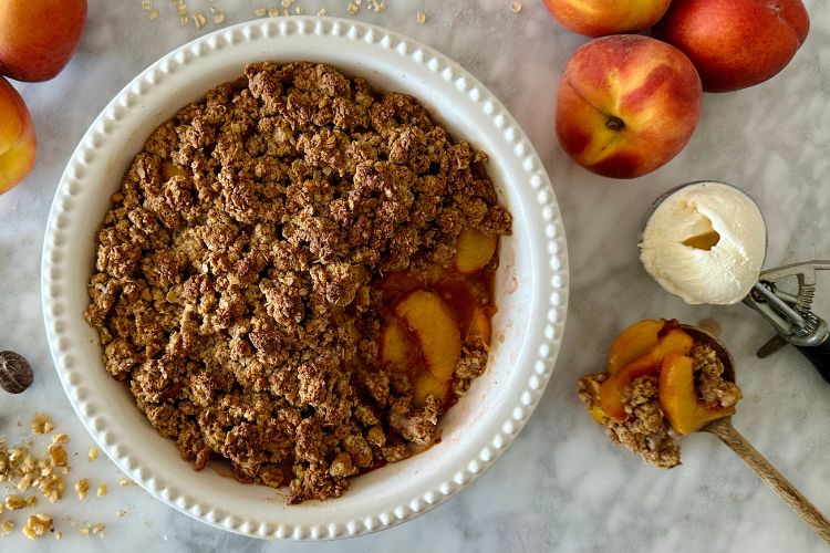 Peach crisp served with ice cream