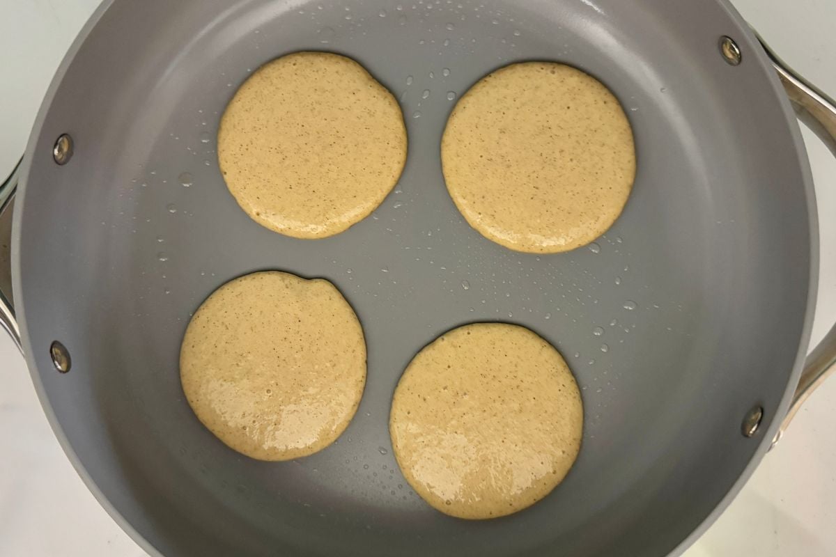Peach pancakes on skillet