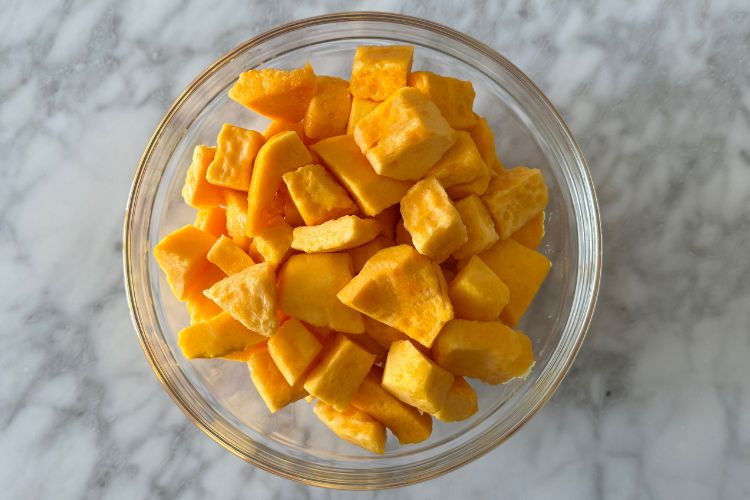 Peeled and chopped butternut squash in bowl