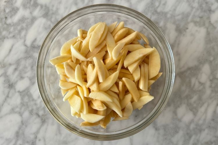 Peeled and sliced apples in bowl