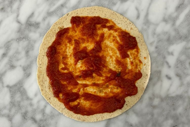 Pizza sauce on tortilla