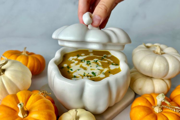 Pumpkin soup with a drizzle of coconut milk