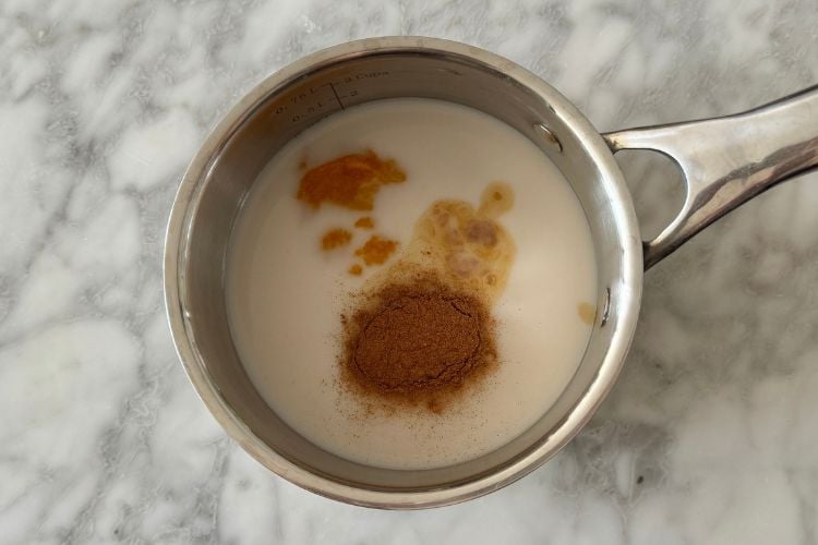 Pumpkin spice chai latte in saucepan