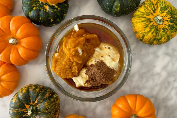 Pumpkin spice yogurt ingredients in bowl