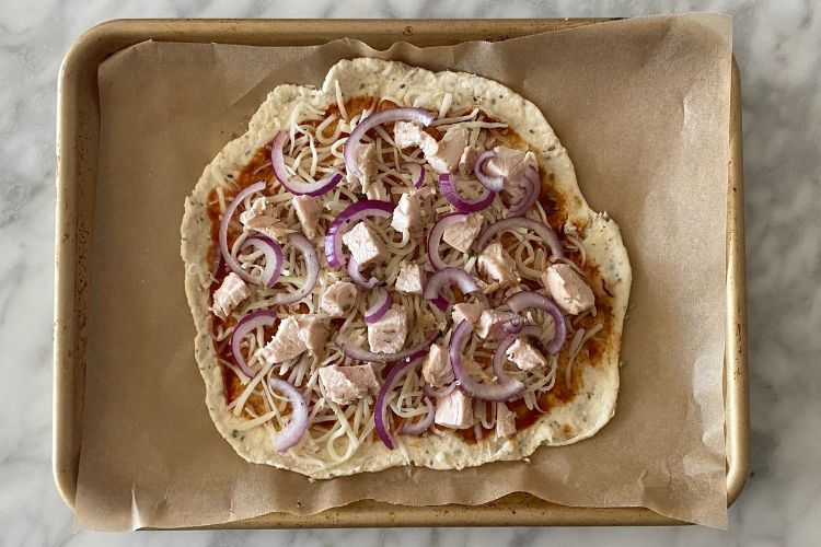 Red onion and barbecue sauce on pizza