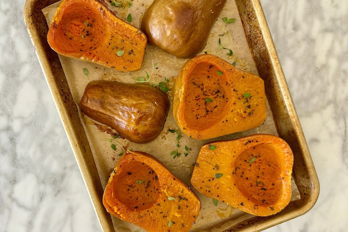 Roasted honeynut squash on a sheet pan