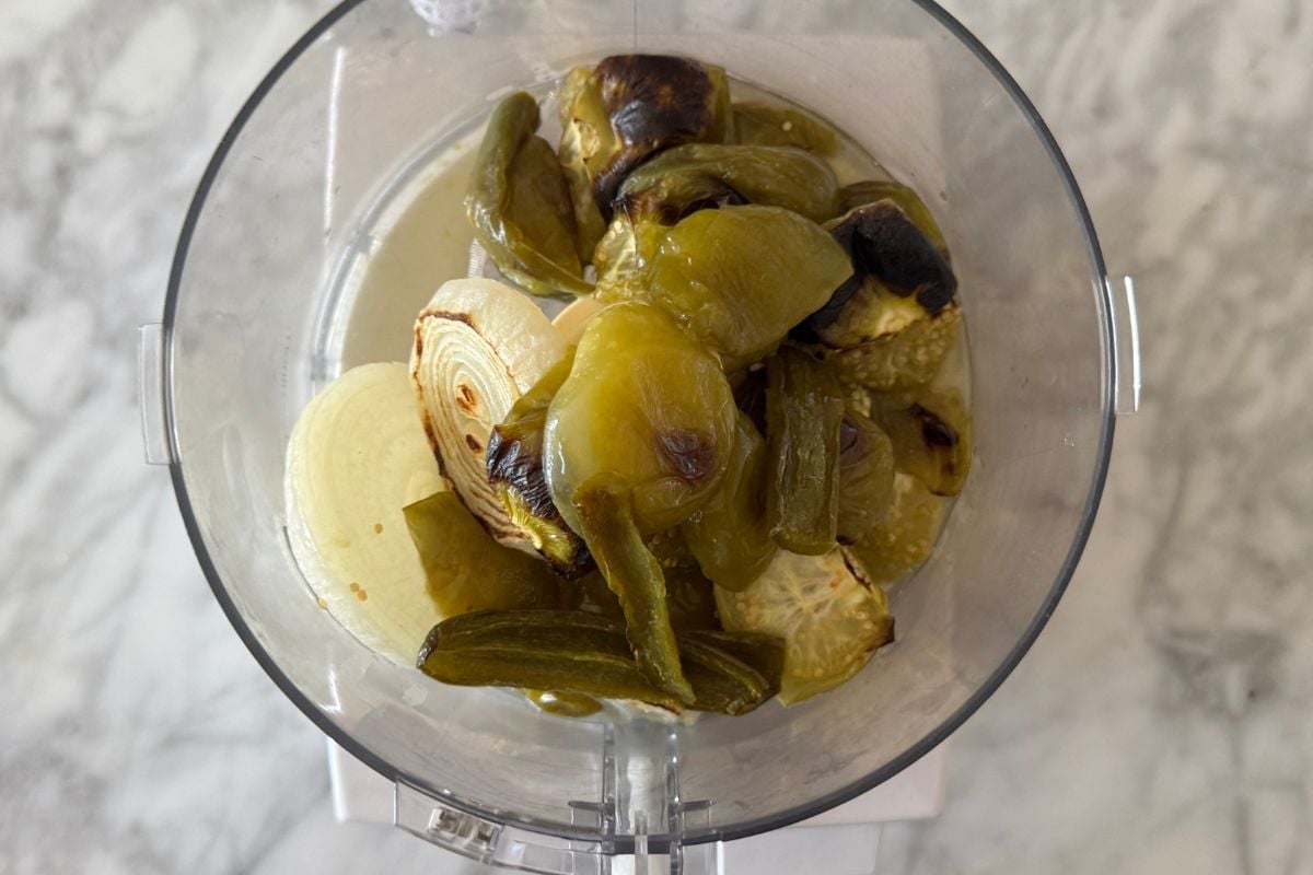Roasted tomatillos in a food processor