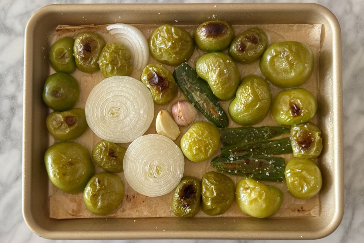 Roasted tomatillos on a sheet pan