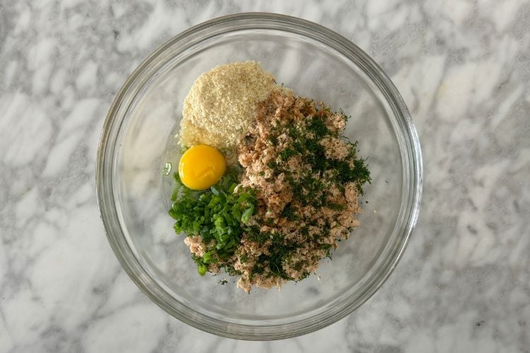 Salmon burger ingredients in bowl