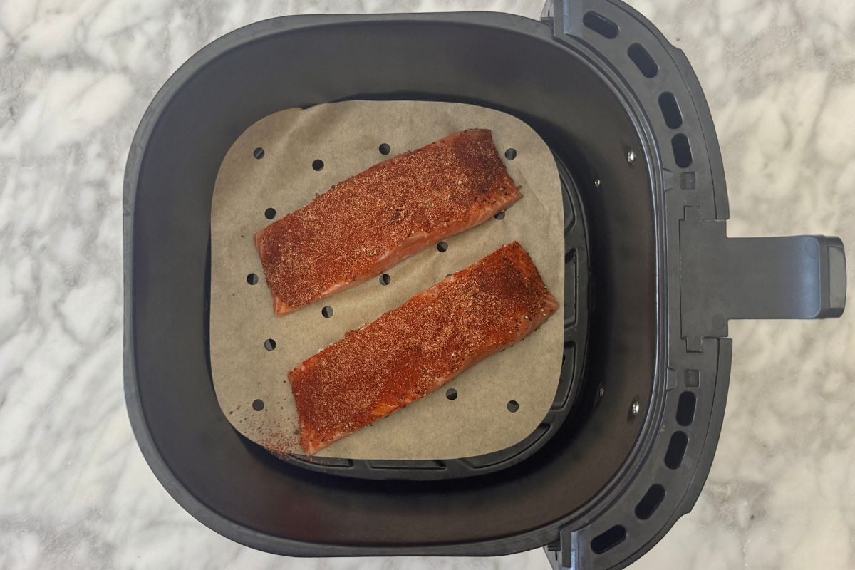 Salmon in an air fryer basket