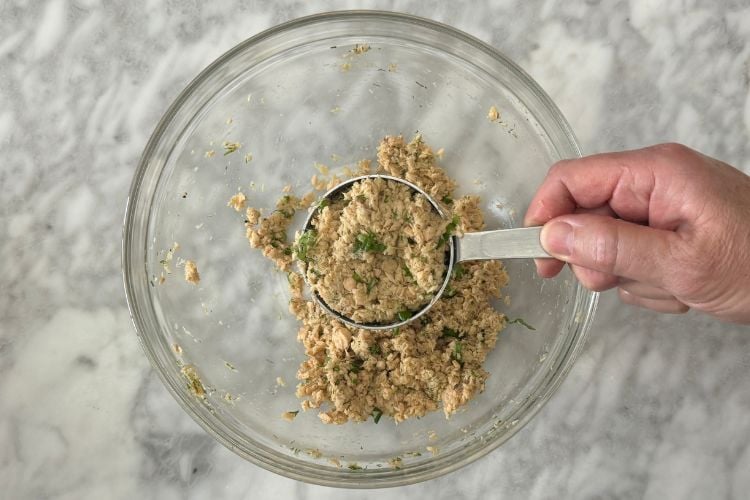 Salmon patties in measuring cup