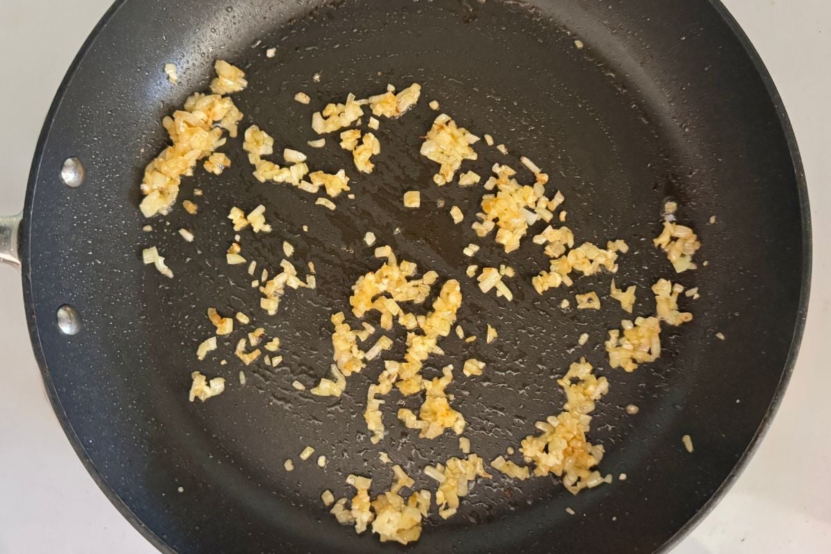 Sauteed shallots and garlic in a skillet