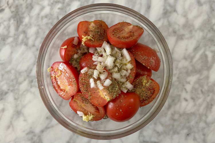 Seasoned Roma tomatoes in bowl