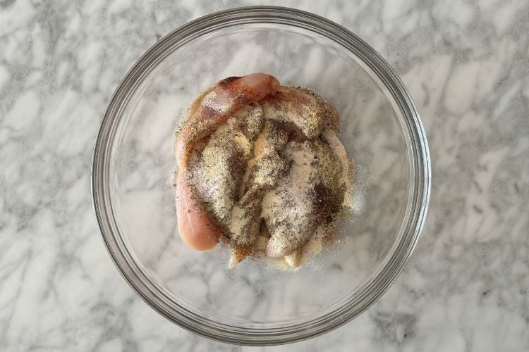 Seasoned chicken tenders in bowl