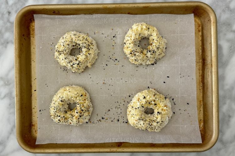 Seasoned cottage cheese bagels on sheet pan