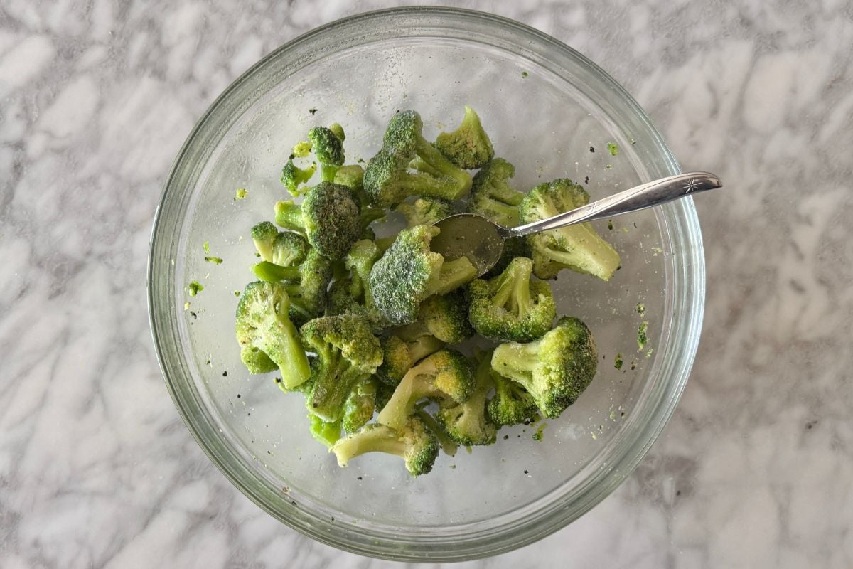 Seasoned frozen broccoli florets in large bowl