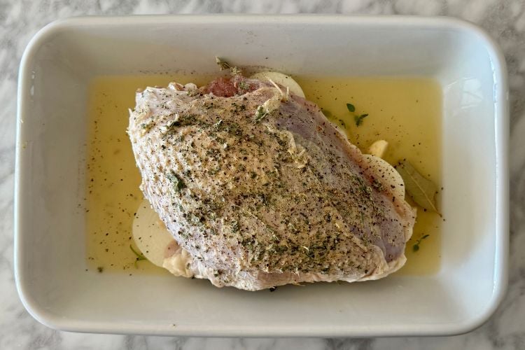 Seasoned turkey in the roasting pan