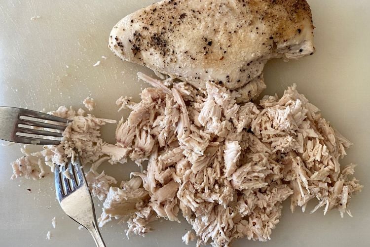 Shred chicken with forks