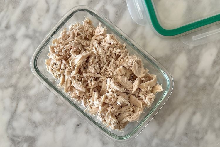 Shredded chicken in glass container