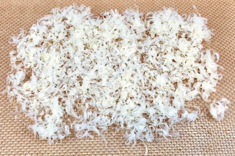 Shredded parmesan on baking mat