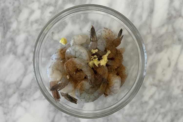 Shrimp in bowl with seasonings
