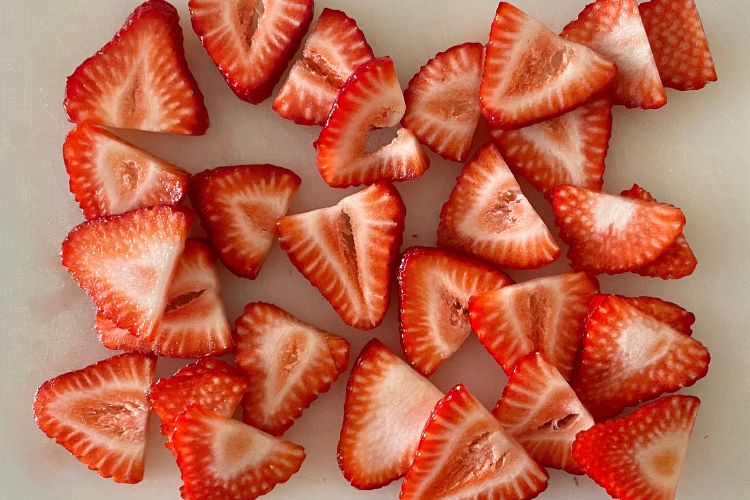 Sliced Strawberries On Cutting Board