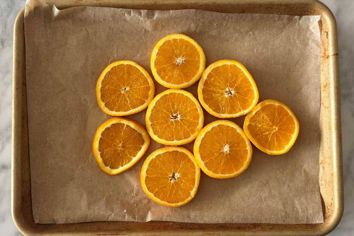 Sliced oranges on a baking sheet