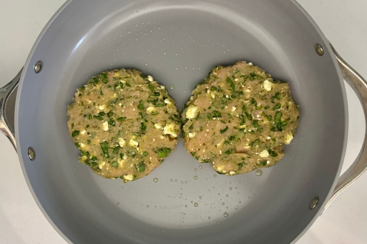 Spinach and feta turkey patties in pan