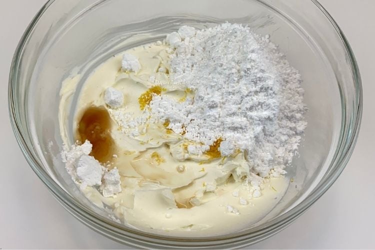 The cream cheese frosting in a bowl