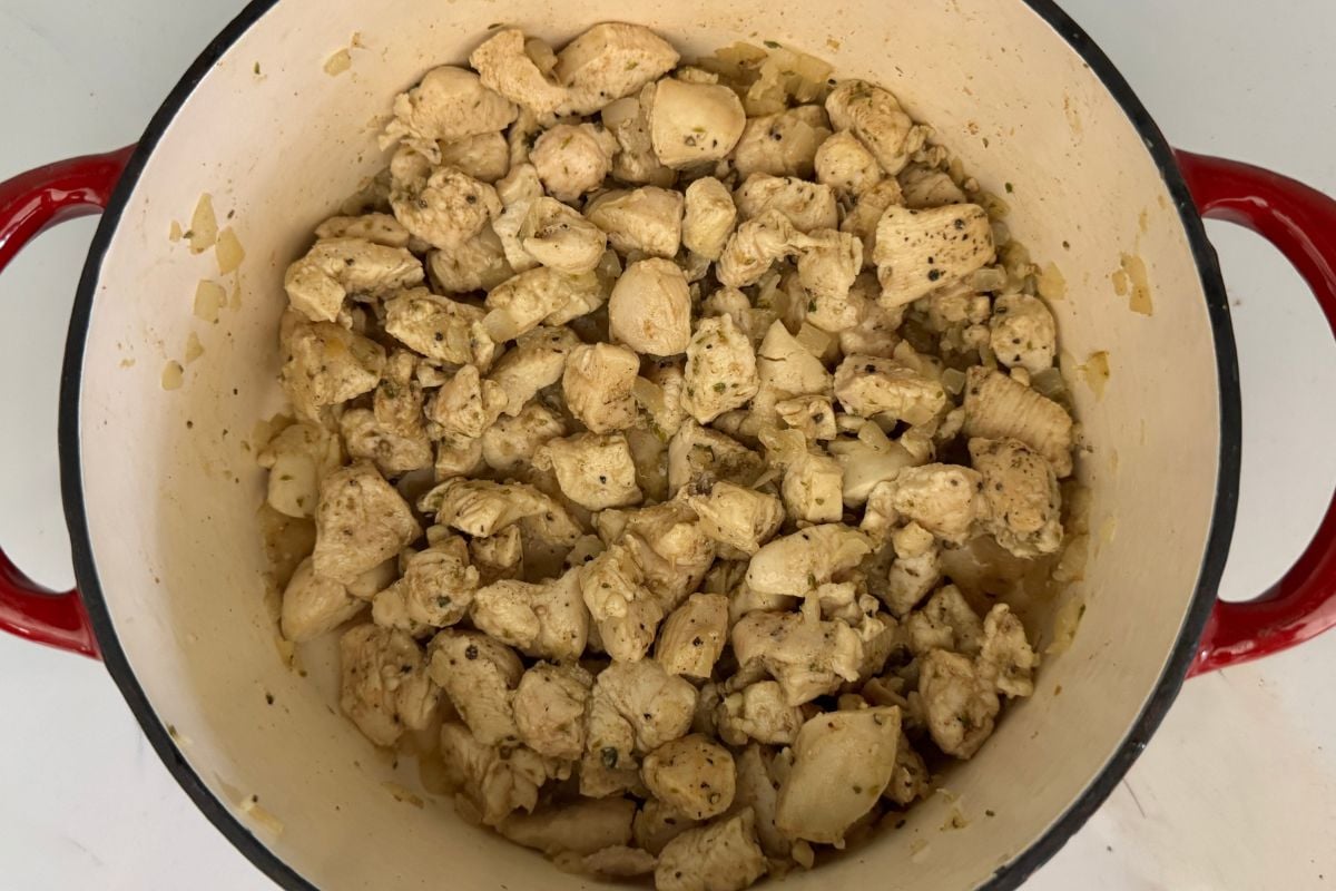 Tomatillo salsa and green chiles in a pan for white chicken chili