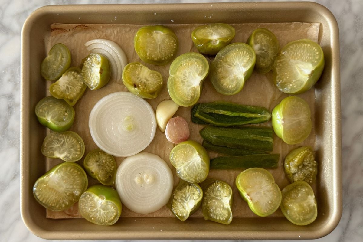 Tomatillos onion and garlic on sheet pan