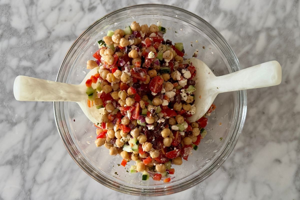 Tossed chickpea salad in dressing