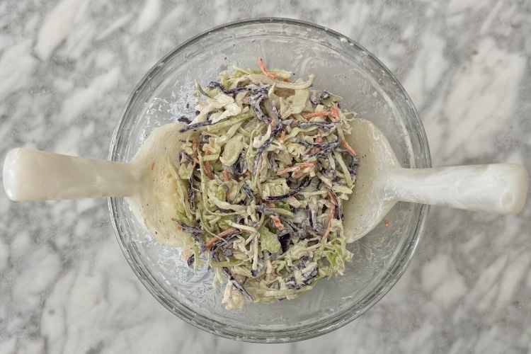 Tossed coleslaw in bowl