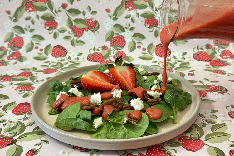 Vinaigrette poured over a salad