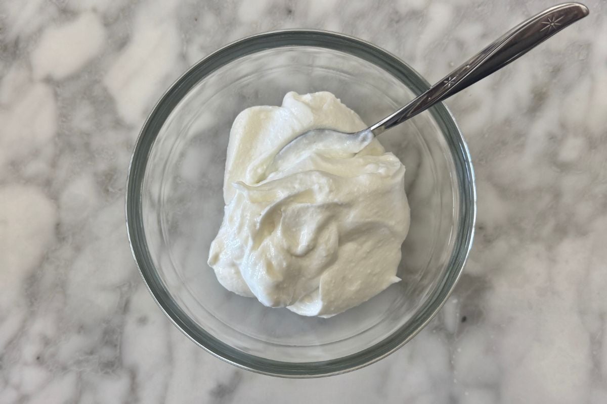 Whipped cottage cheese in a bowl for chicken salad