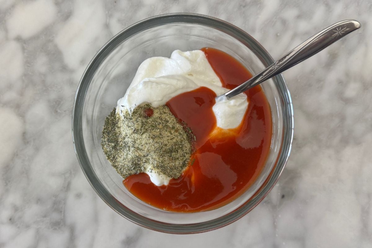 Whipped cottage cheese with ranch seasoning and hot sauce in bowl