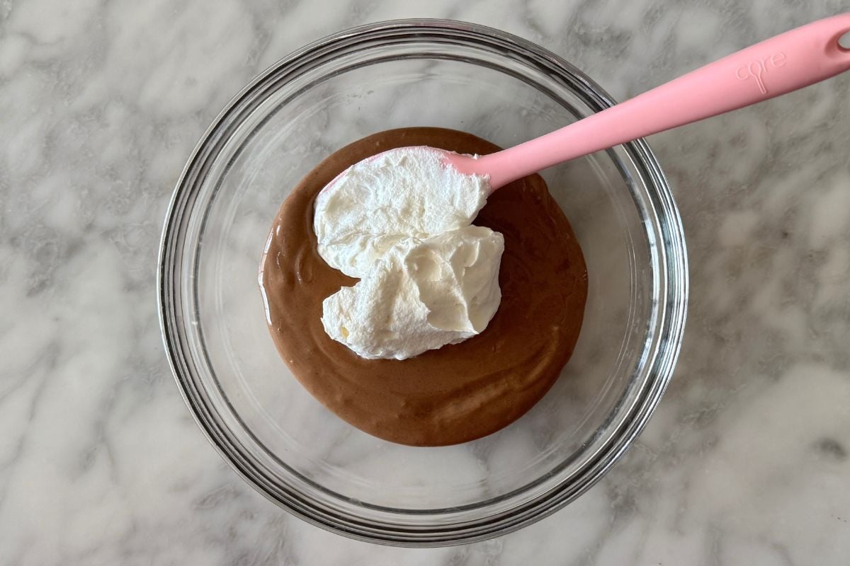 Whipped topping in bowl with chocolate mousse