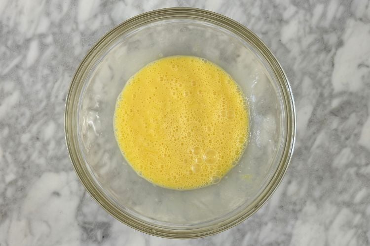 Whisked eggs in a large bowl