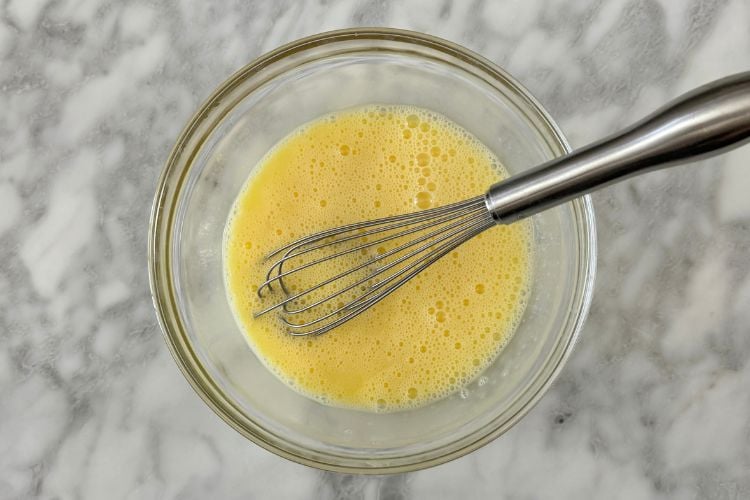 Whisked eggs in a bowl
