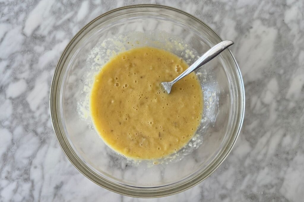 Whisked wet ingredients for muffins in bowl