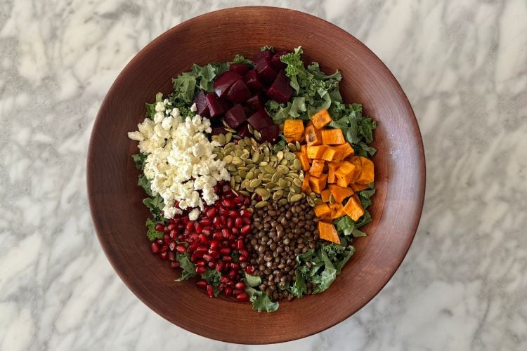 Winter kale salad ingredients in bowl