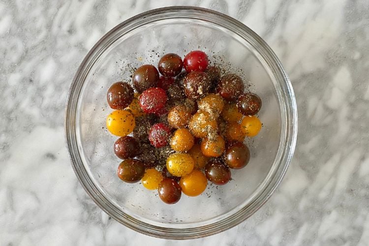 cherry tomatoes with seasonings in bowl