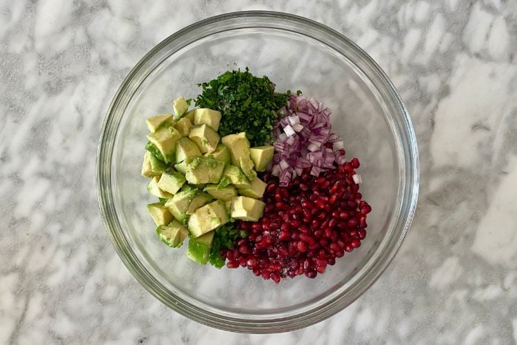 Pomegranate salsa ingredients in a bowl